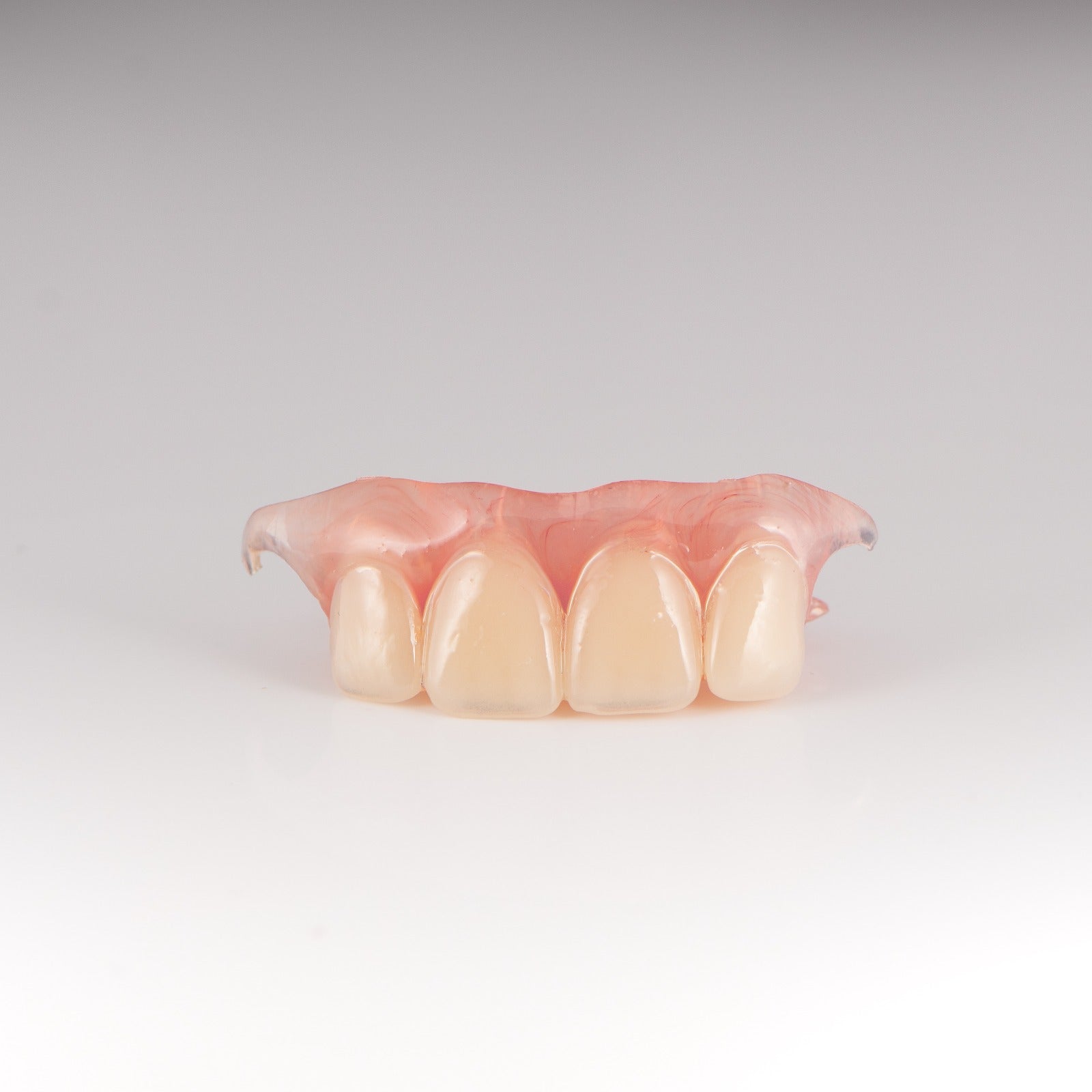 Upper Flexible Partial Denture on Gray Background