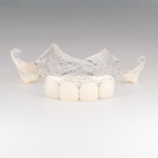Clear Flexible Partial Denture on Gray Background