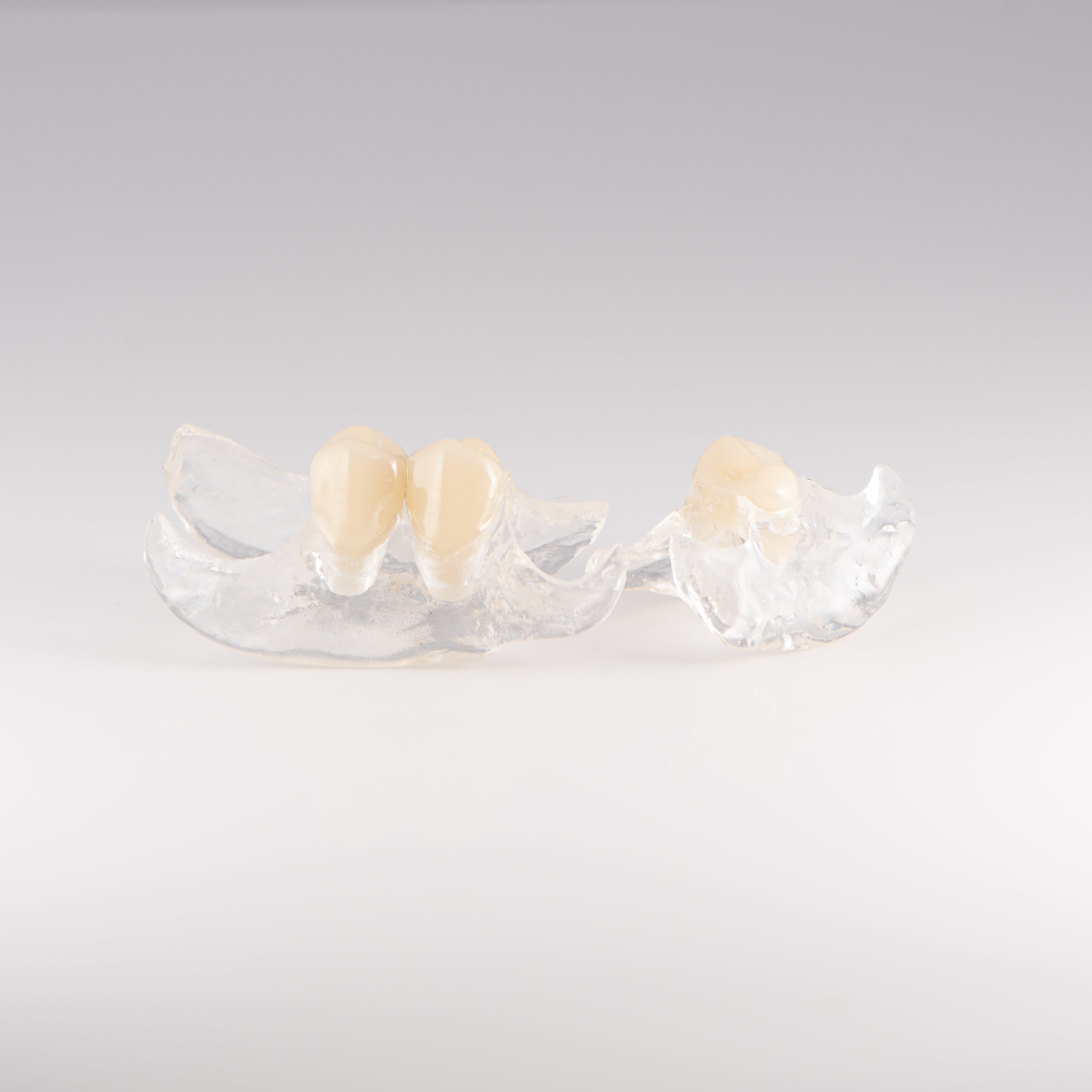 Two Clear Unilateral Partial Denture with Gray Background