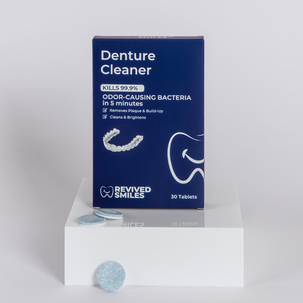 Revived Smiles Denture cleaner packaging with tablets on a white platform