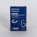 Box of Denture Cleaner by Revived Smiles on a gray background