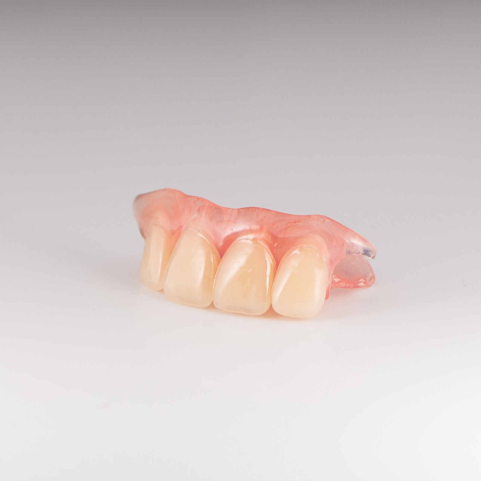 Upper Flexible Partial Denture on Gray Background