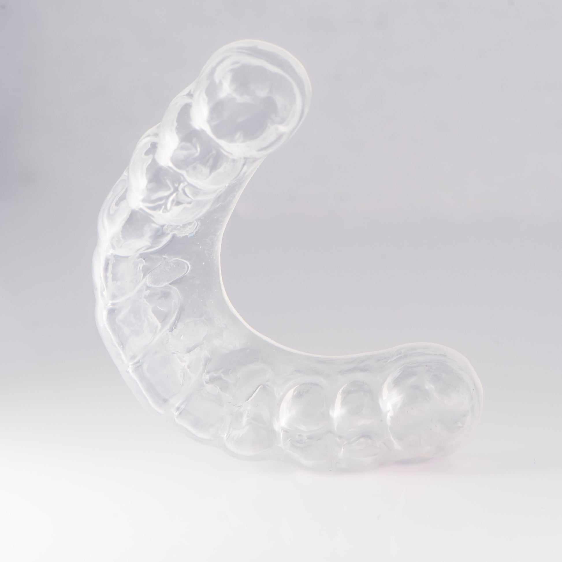 Clear Sports Mouthguard with Light Gray Background