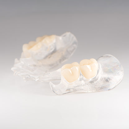 Clear Flexible Partial Denture on Gray Background