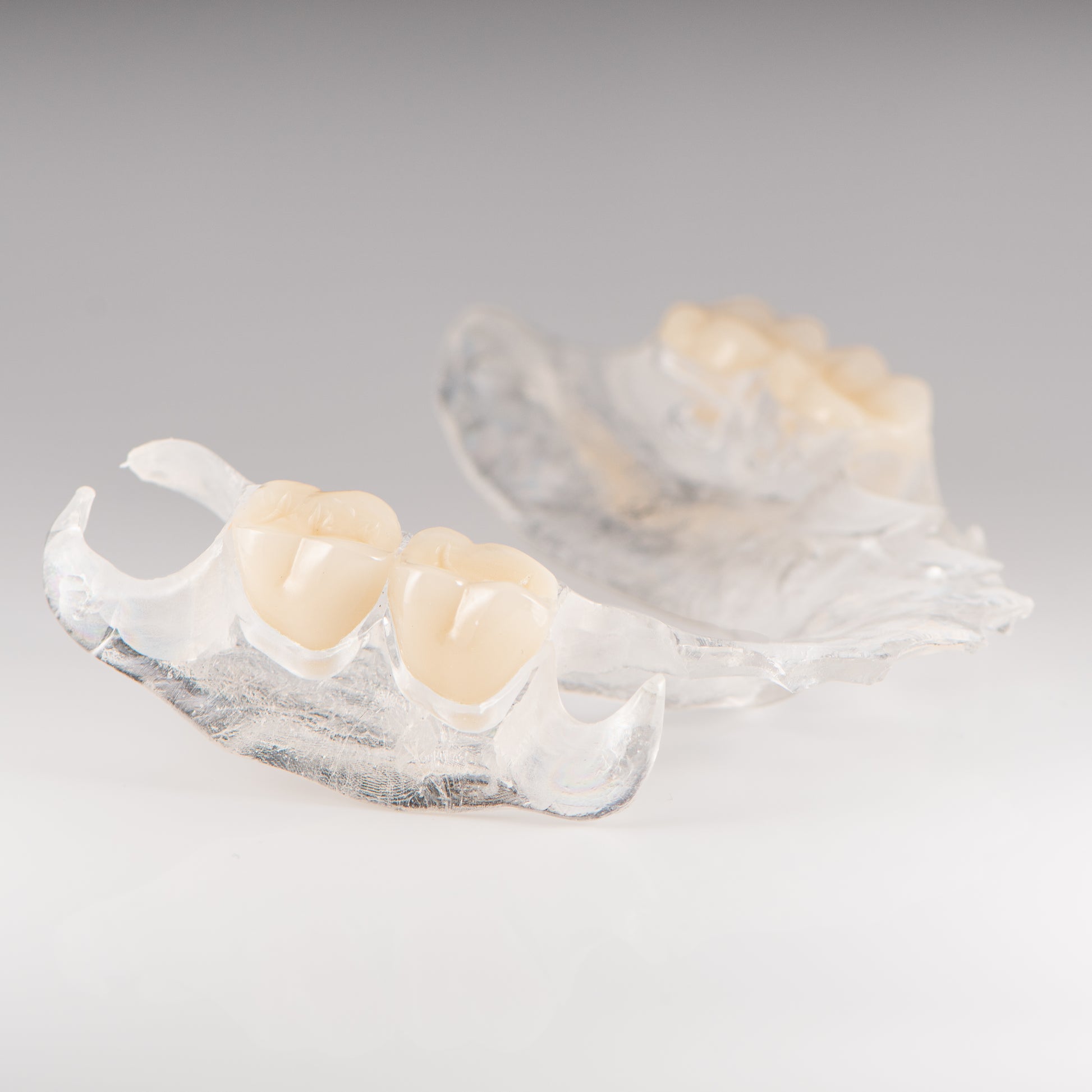 Clear Flexible Partial Denture on Gray Background