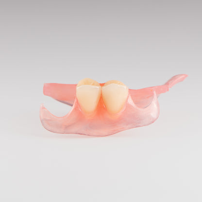 Two-Tooth Unilateral Partial Denture on Gray Background