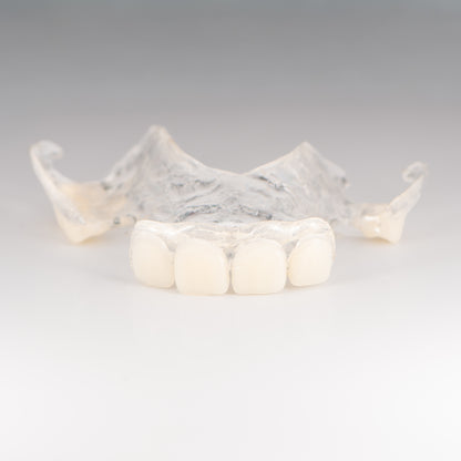 Clear Flexible Partial Denture on Gray Background