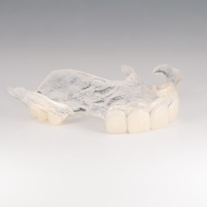 Clear Flexible Partial Denture on Gray Background