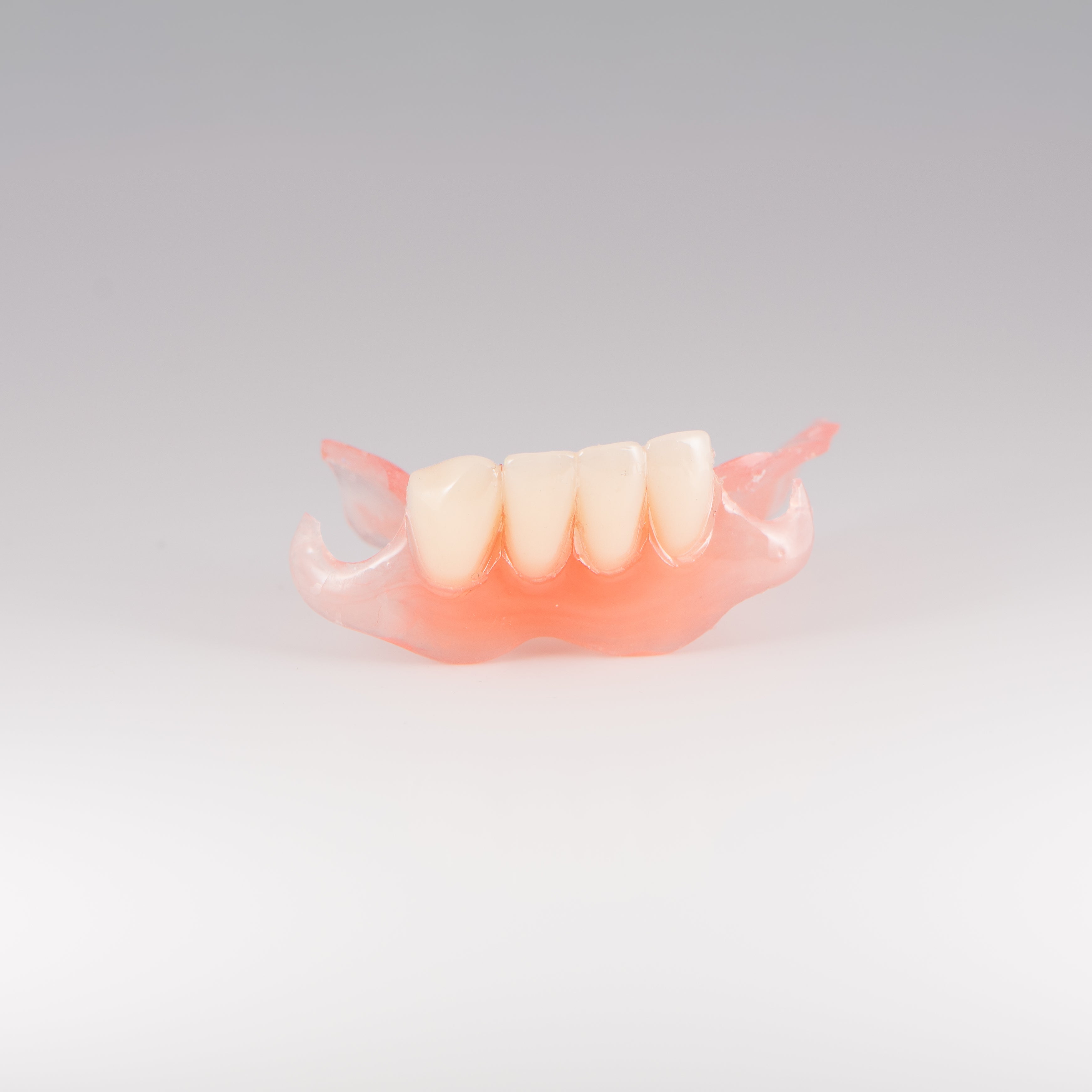 Flexible Partial Denture on Gray Background