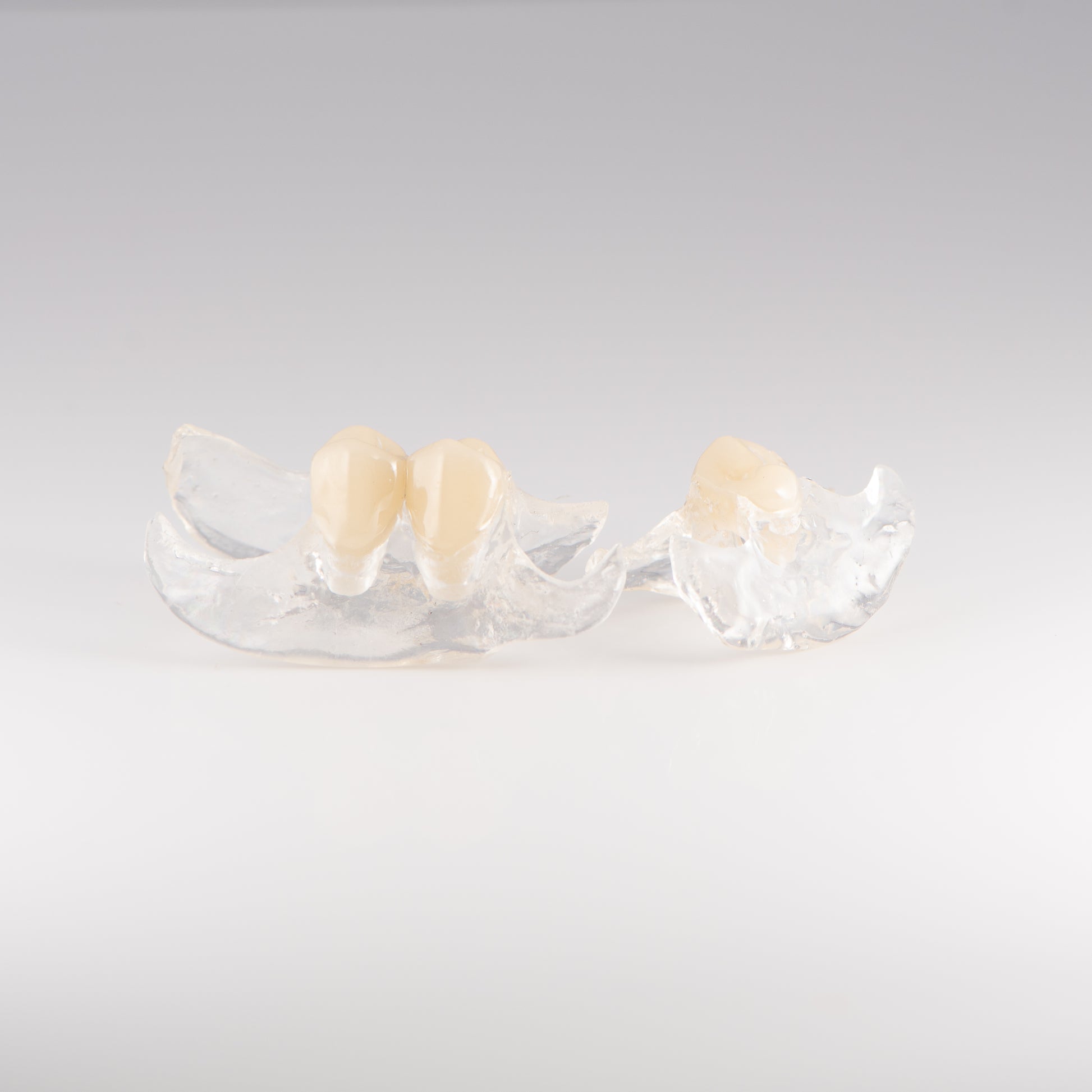 Two Clear Unilateral Partial Denture with Gray Background