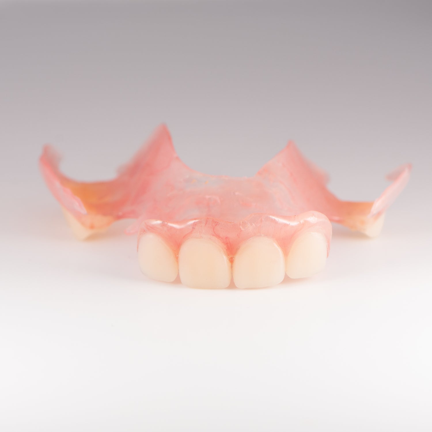 Upper Flexible Partial Denture on Gray Background