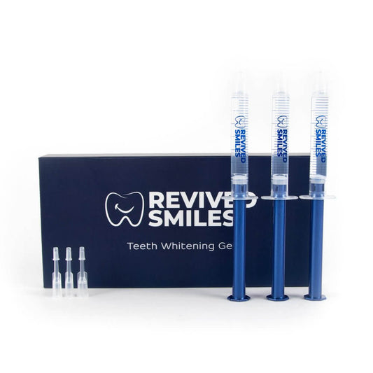 Revive Smiles teeth whitening gel set with syringes and packaging on a white background